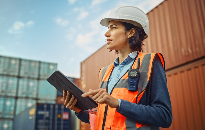 woman in working attire with ipad